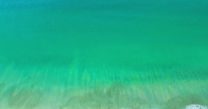 Aerial view of blue sky and Emerald Sea
Soft daylight filters through a thick veil of clouds, revealing intricate patterns stretching across the sky. Atmospheric Tranquility.The scene balances a calm