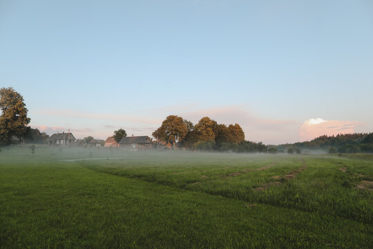 Scenic picturesque landscape view. rural nature in countryside in summer morning, foggy sunrise. Serene peaceful nature countryside