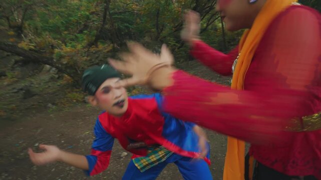 Traditional Indonesian Sundanese Couple Dancers Performing Jaipong Duet in Nature