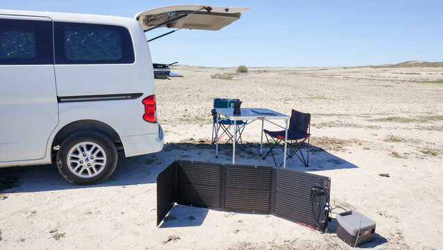 Van life mobile camping with portable solar panel charging