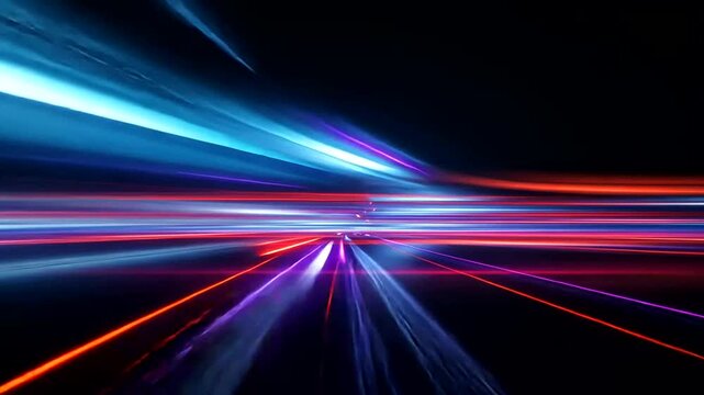 Streaking neon lights create a sense of rapid motion in the dark