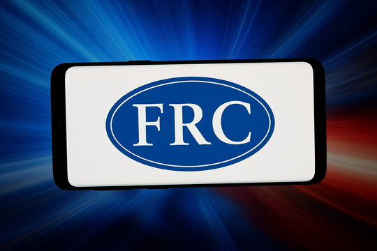 Stuttgart, Germany - 05-13-2026: In this photo illustration, the logo of regulator Financial Reporting Council (FRC) is displayed on a smartphone in front of abstract background on computer screen.