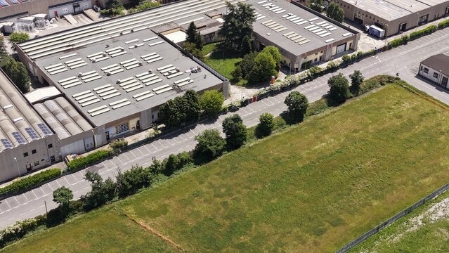 Industrial Park Aerial View: An expansive aerial perspective showcases a modern industrial park with various factory buildings and warehouses.
