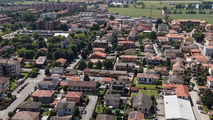 Residential Neighborhood Aerial View: An aerial perspective reveals a sprawling residential neighborhood with a mix of single-family homes Pantigliate, Lombardy, Italy, © Andrew