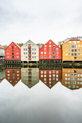 Fototapeta premium Colorful wooden houses on the banks of the Nidelva River in Trondheim