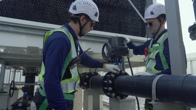 Engineer maintenance hvac cooling tower technician valve pipeline safety support perform service on rooftop unit, adjust valve and actuator, check pipe joint and flange connection for heat removal
