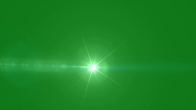 Cinematic optical lens flare moving animation. white lamp rays effect projection on green background, blue optical lens flares lights for transitions and title reveals