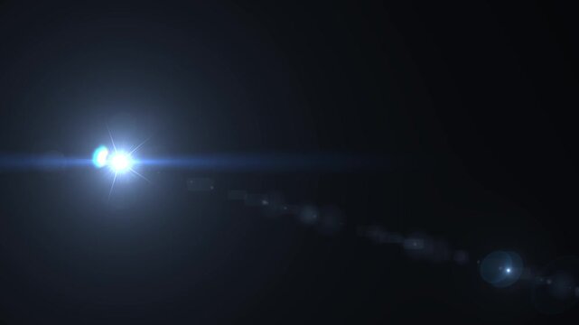 Lighting optical lens flares light moving from right to left. Optical flash lights.