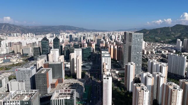 Lanzhou China Modern Urban Skyline with High Rise Buildings and Mountains