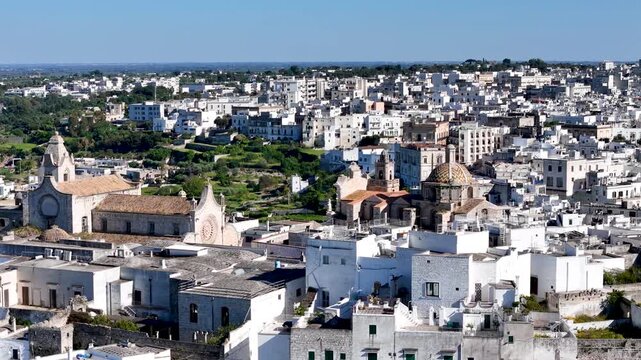 Ostuni, the White City of Puglia. Aerial 4K drone video footage with view of panorama of historic Italian architecture and Mediterranean landscape. Whitewashed old town