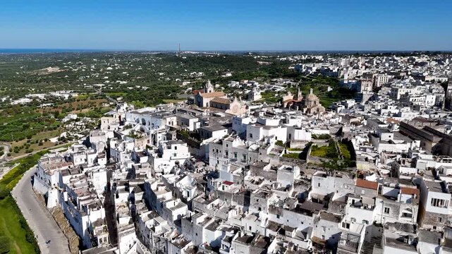 Ostuni, the White City of Puglia. Aerial 4K drone video footage with view of panorama of historic Italian architecture and Mediterranean landscape. Whitewashed old town