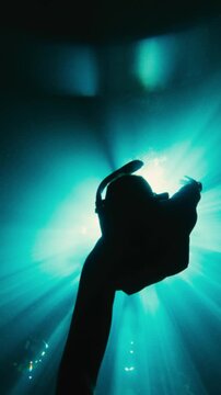 Vertical Underwater Video of Man Free Diving in Cenote Near Puerto Morelos With Sun Beams Through Water