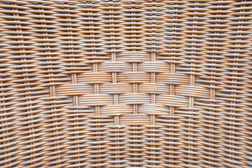 Obraz premium Rattan or technorattan tape used for furniture restoration. Wicker chair texture. Woven chair weave. Texture of technorattan.