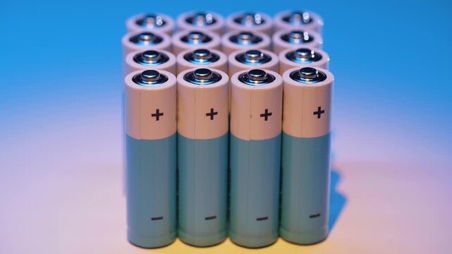 Several batteries neatly stacked in a vertical column