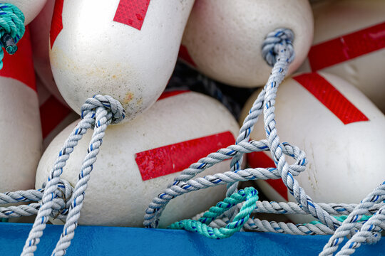 Close up view of red and white buoys in a pile