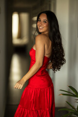 Fototapeta premium Young brunette woman with a party dress