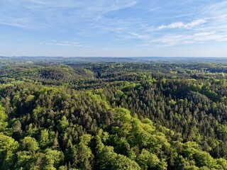 Fototapeta premium Scenic countryside with diverse features. Piecedtogether aerial view of rolling terrain and lush greenery