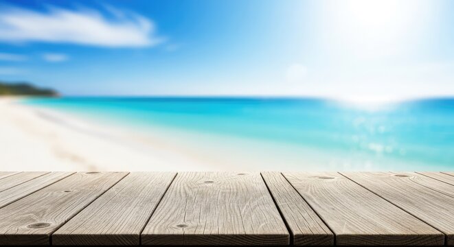 A weathered wooden tabletop sits before a soft bokeh background of a sunny coastline with white sand, turquoise sea, and bright blue sky, horizon, bright, defocused