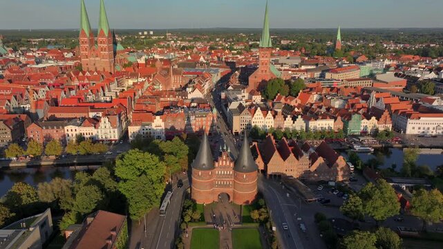 Lubeck city Aerial shot. Saint Marie and saint peter churches, Holstentor Gothic gate, Schleswig-Holstein land, Germany