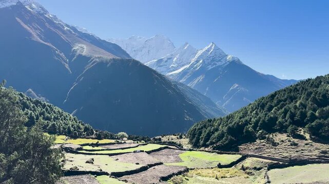 Himalayan peaks above terraced fields in Khumbu Valley, Nepal