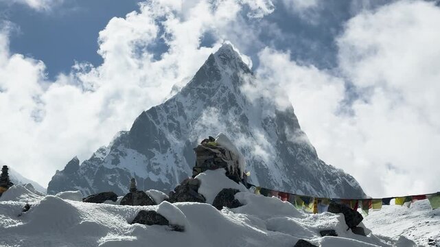 Taboche mountain behind prayer flags at Thukla Pass in Nepal