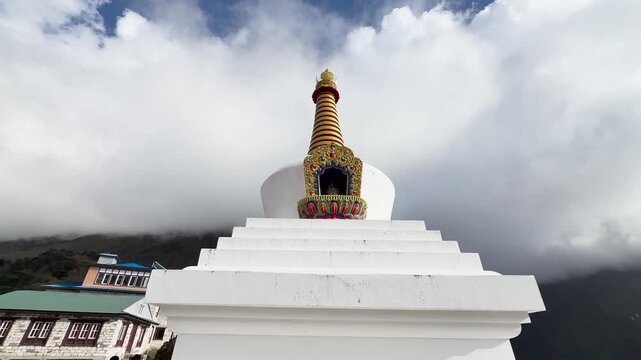 White Buddhist stupa with golden spire in Himalayas, Nepal