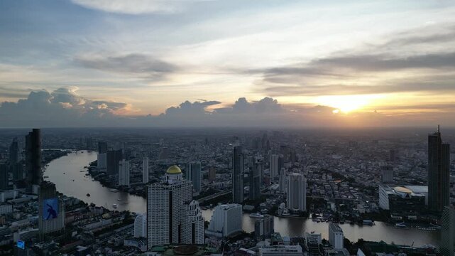 Aerial View of Bangkok Cityscape with Sunset and River in Bangkok, Thailand