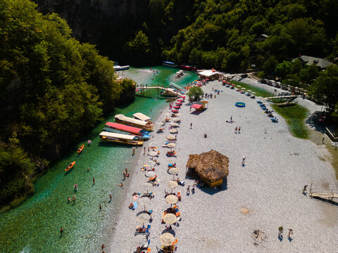 Stunning aerial drone view of the crystal clear Shala River flowing through a deep mountain canyon near Komani Lake in Northern Albania.