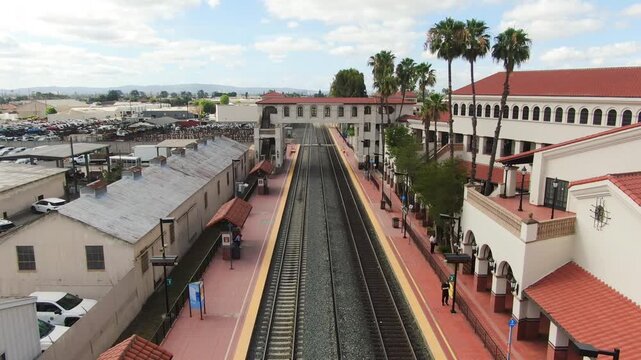 Aerial Tracking View of Rail Corridor and Station Infrastructure