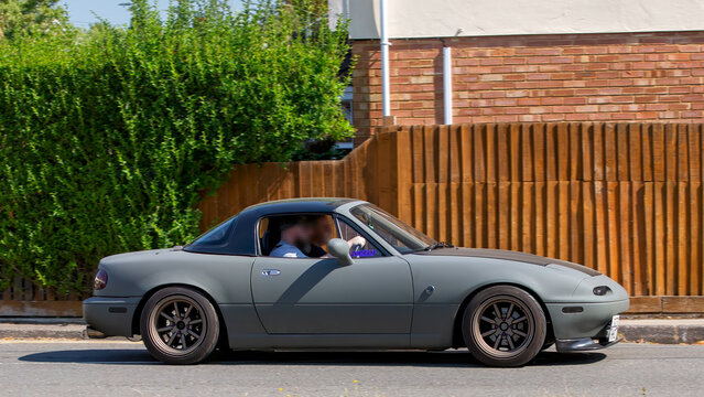 Bletchley,Bucks,UK - Aug 25th 2025:  1994 Mazda mx 5 classic  car driving on a British road
