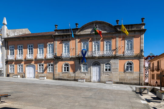 Arcos de valdevez town hall building displaying flags and blue ribbon