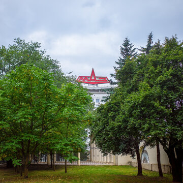 Large red industrial Logo of Minsk Automobile Planton top of building