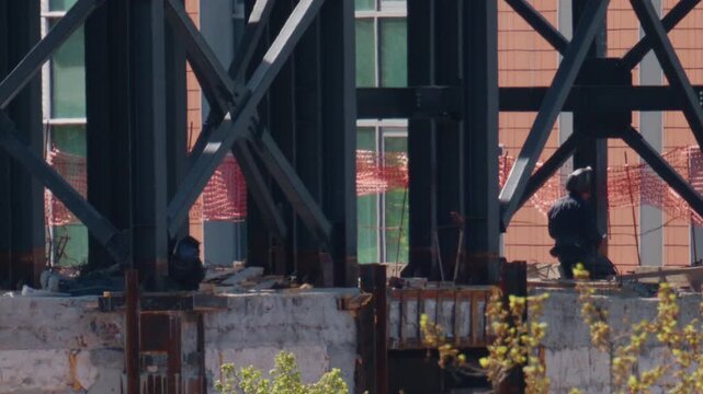 Close up view of steel beams and structural supports on an active construction site