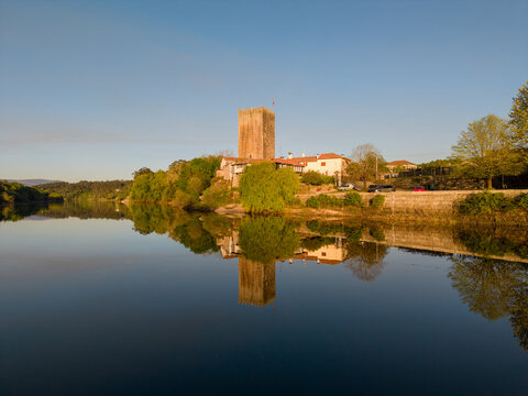 Tower of lapela reflecting in minho river water