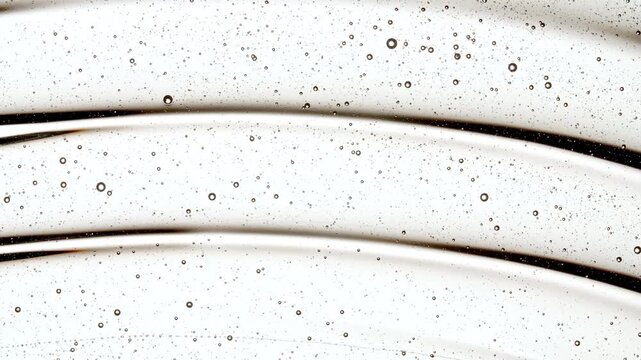 Transparent Gel, Serum, Oi Cosmetic With Molecule Bubbles As It Slowly Slides Down. - Macro Shot. Abstract Background for Cosmetics Commercial Product. High quality 4k footage