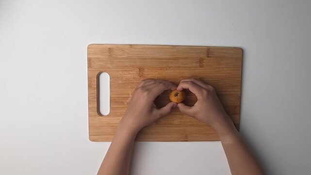 Hand holding loquats. Yellow fruit hand. medlar in hand, close-up. High quality photo