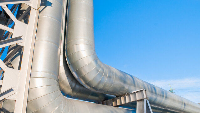 pipeline and metal support against the blue sky
