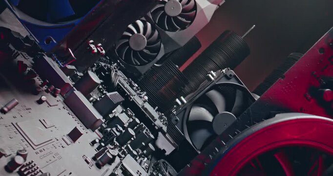 Motherboards, graphic cards and fans. Camera move along components.