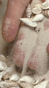 Slow Motion View Of Delicate Sand Grains Trickling Over Small