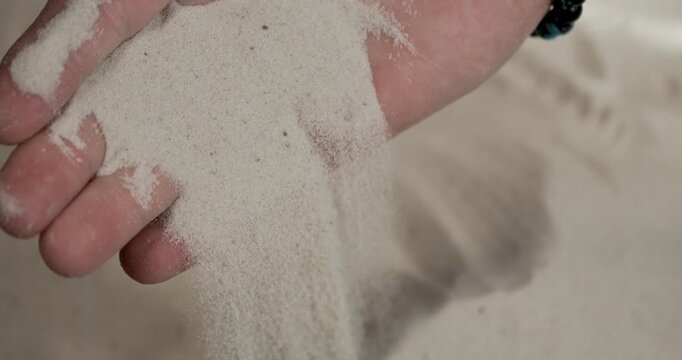 Caucasian Palm Sifting Sand, Super Slow Motion Closeup