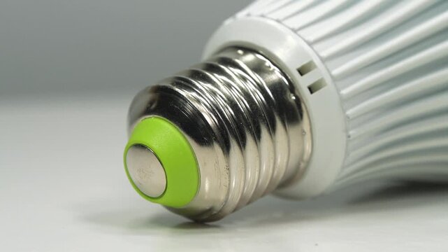 White energy saving LED lamp with E27 base, close-up video