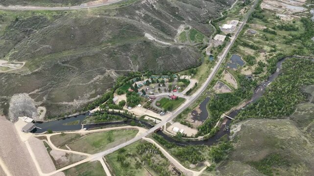 Aerial of Provo River below Jordanelle Reservoir dam in Heber Valley in Utah in spring
