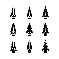 Obraz premium Collection of nine black arrowheads on a white background.