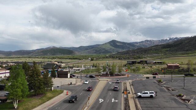 Aerial of round a bout in Kimball Junction in Utah near Park City in spring with cloudy sky