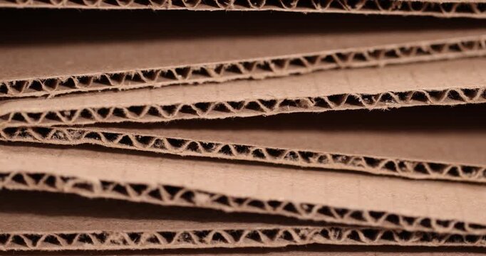 old crumpled cardboard folded for storage, used old cardboard from recycled paper is stored after using it as packaging material, close up