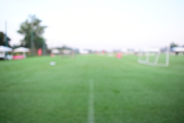 Fototapeta premium abstract blur green grass in springtime, compettition season