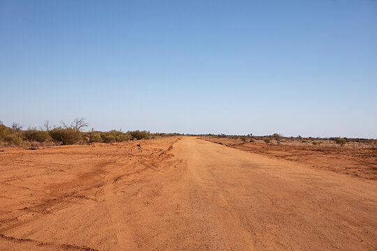 Wide open road stretching into the horizon of the vast Australian outback landscape  in New South Wales 