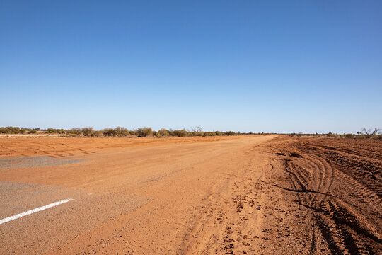 Wide open road stretching into the horizon of the vast Australian outback landscape  in New South Wales 