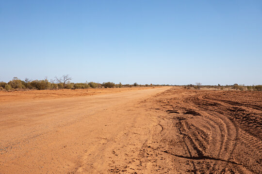 Wide open road stretching into the horizon of the vast Australian outback landscape  in New South Wales 