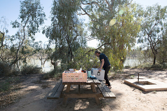 Setting up for a camping lunch picnic at Lake Menindee in outback Australia